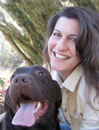 Publisher Nancy Cleary and her dog Book