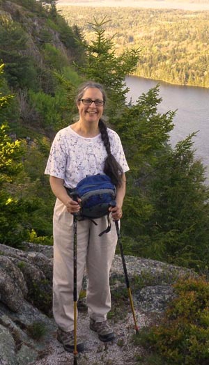 hiker with walking sticks